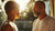 A father and son share a warm, sunlit moment, representing the genetic and emotional connection between generations, linked to childhood bedwetting.