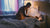 Loving mother tucking in her daughter at bedtime – Oopsie Heroes helps kids wake up dry and confident.