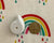 A close-up of the Oopsie Heroes bedwetting alarm sensor, a small and discreet device designed to help children stop bedwetting by waking them at the right time.